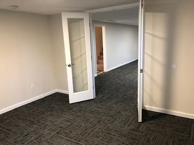 french doors into bedroom, flex space with escape window. Lots of natural light.