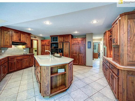 Large kitchen area, island, connects to laundry and full bathroom.