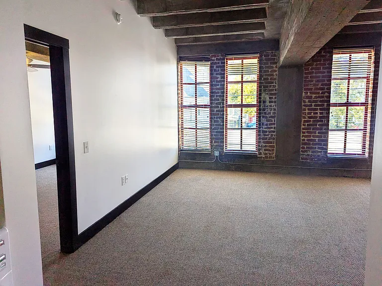 Livingroom with a brick wall at 3 Points Loft.