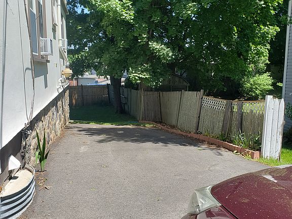Private offstreet driveway can accommodate three cars in line.