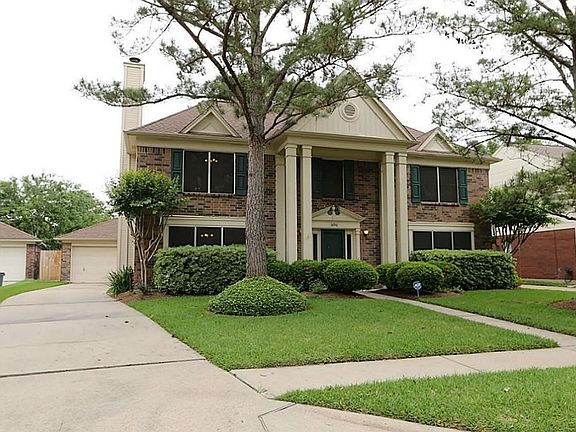 This lovely home has a 2 car detached garage, front columns, a storm door, sun screens and a front s