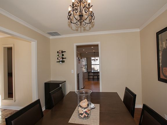 Dining withchandelier and crown molding