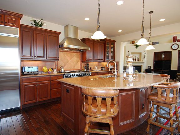 Viking appliance package at kitchen includes warming drawer. Granite counters