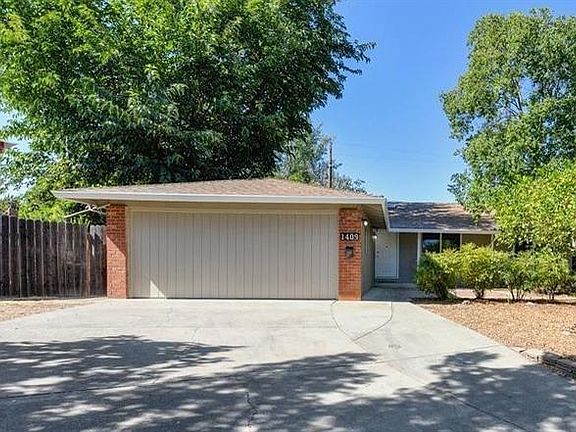 Driveway with RV storage to the left.