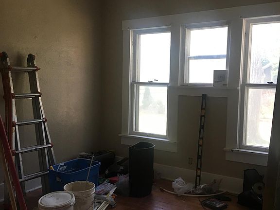 Bedroom number two. Please ignore the mess! The floors are beautiful!
