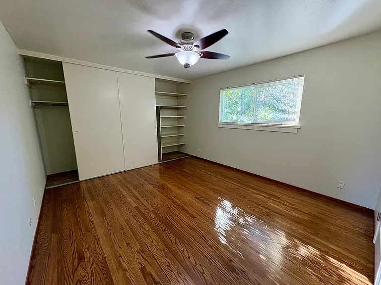 Bedroom with wall to wall closet