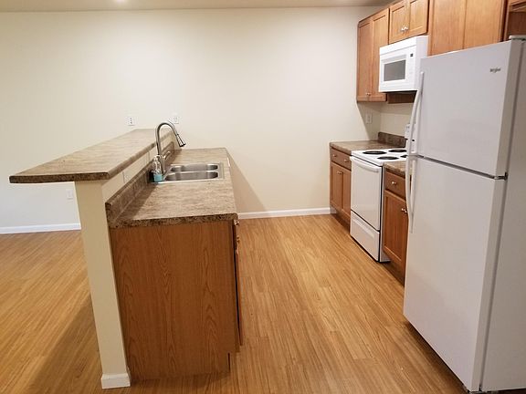 Counter space and breakfast bar.
