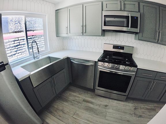 Wide-angle image of kitchen "triangle" area