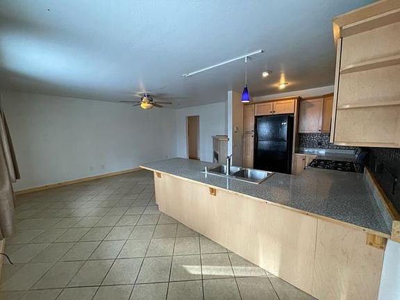 Kitchen/breakfast bar and living area