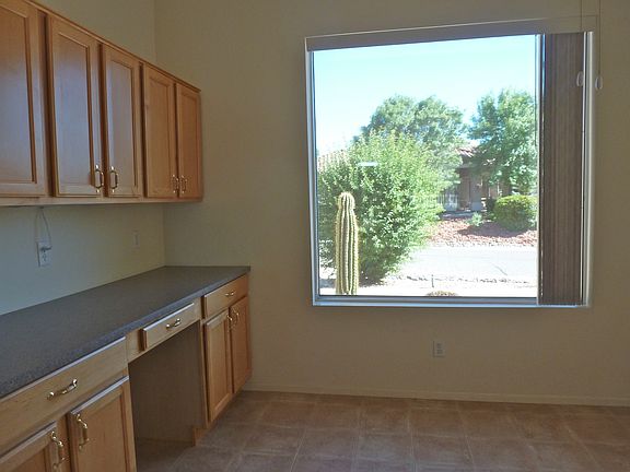 Kitchen dining area has desk