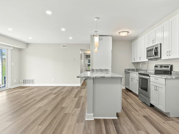 3 bedroom photo of kitchen living room