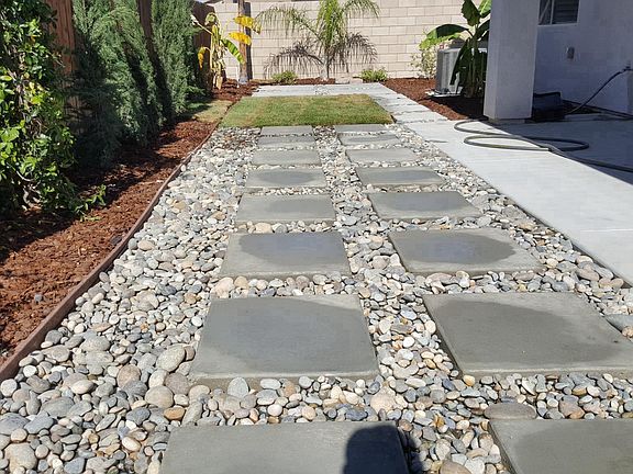 water saving back yard design with Summer time water Play ar