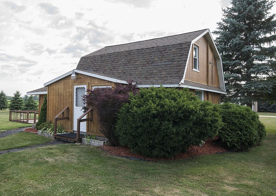 LOVELY ON LAPORTE...is a home you must see to appreciate!  This unique, 974 square foot, cute and clean two bedroom barn style home has so much charm! Situated on a quiet country lot conveniently located between Midland and Saginaw Township, this well maintained home has neutral colors throughout and is truly "move in ready".   The  floating deck in the back yard is surrounded by beautiful landscaping and makes a great place to enjoy a peaceful evening dinner for two! Home also has a large pole barn with 220 electrical hookup, an easily accessible loft for additional storage and a spacious built in work bench area.  Home would make the perfect starter home for a new family!  Call today for your private showing!