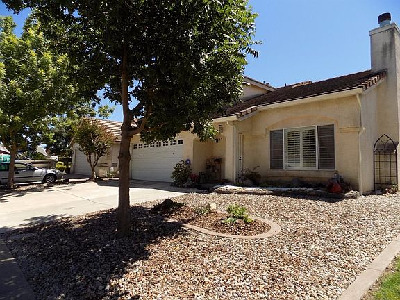Side view from Rizal Court. Low maintenance front landscaping.