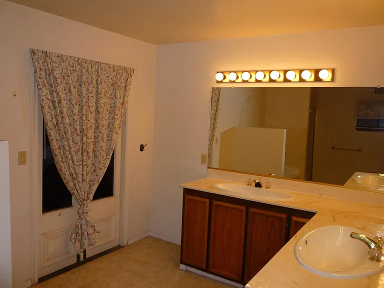 Master Bathroom with Dual Sinks and external door