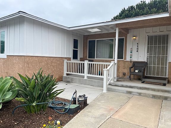 New vinyl fence on patio up front