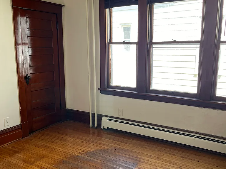 Three windows in dining room providing lots of light. Coat closet offers storage.