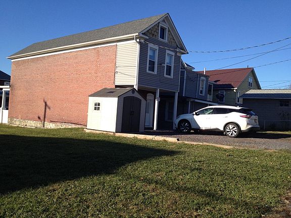 Rear of house with shed & parking area