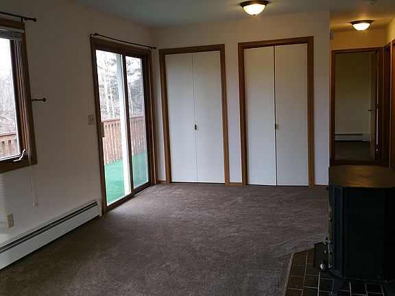 Living Room facing hall with BR and 2 bedrooms. Closet storage.