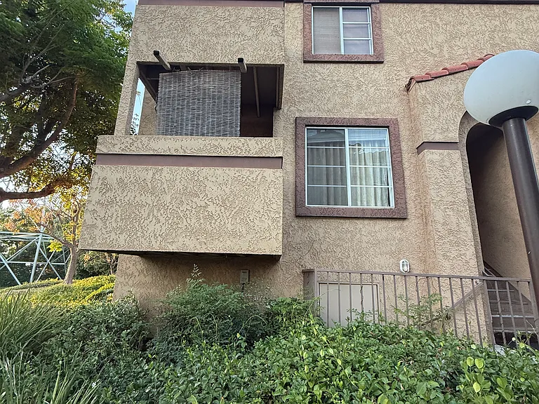 Outside look of unit from stairs from stairs