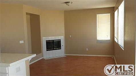 Family Room with Fireplace.  New Paint and Wood Laminate Flooring.