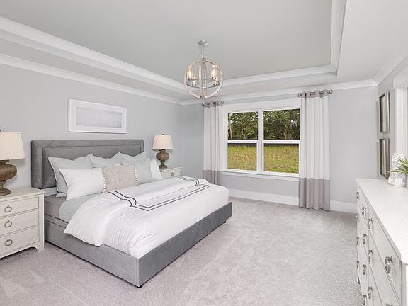 Owner s suite bath with oversized walk-in tile shower equipped with dual shower heads and bench, spa