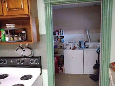 Kitchen and laundry area. These machines are not there. Only hookups available.
