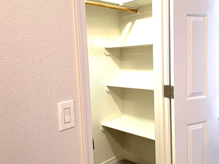 primary bedroom walk in closet right side