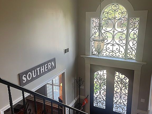 Foyer with custom iron work