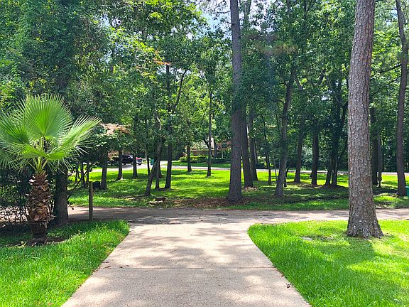 Large green space in front.