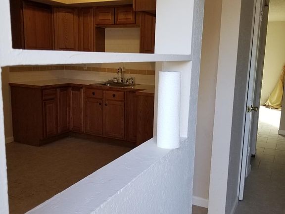 entry, cute opening to eat-in kitchen
