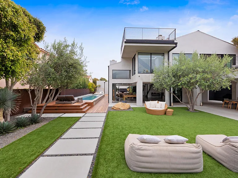 Comfortable hand-picked furniture throughout the luxurious outdoor space.