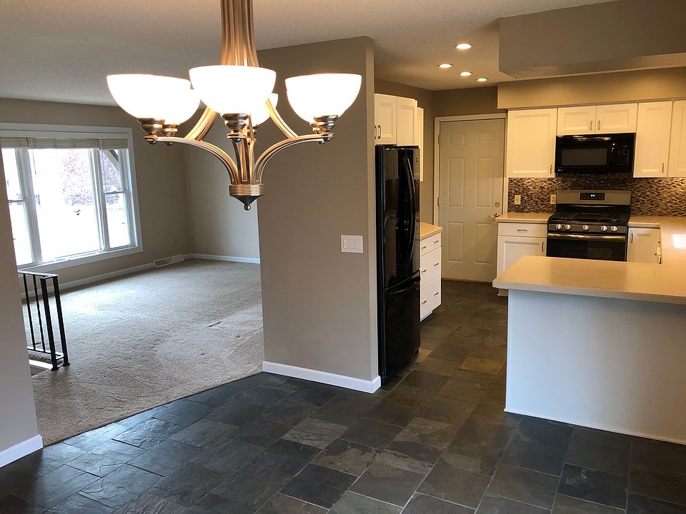 View of living room and kitchen from dining room.