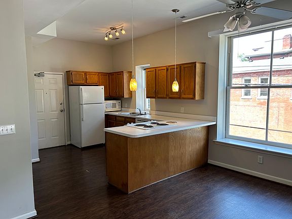 View of kitchen and entry door from great room.