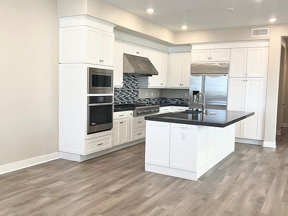 Bright and white kitchen, quartz counters