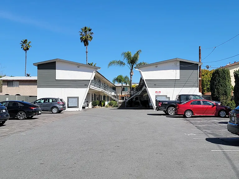 Assigned parking with some assigned covered garages at Orlando Woods Apartments in El Cajon, California.