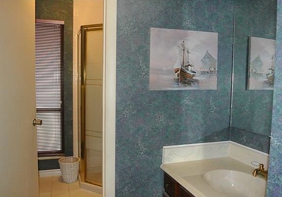 Bathroom with laundry facilities upstairs