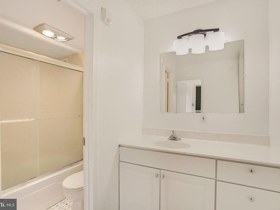 Vanity and bathroom.