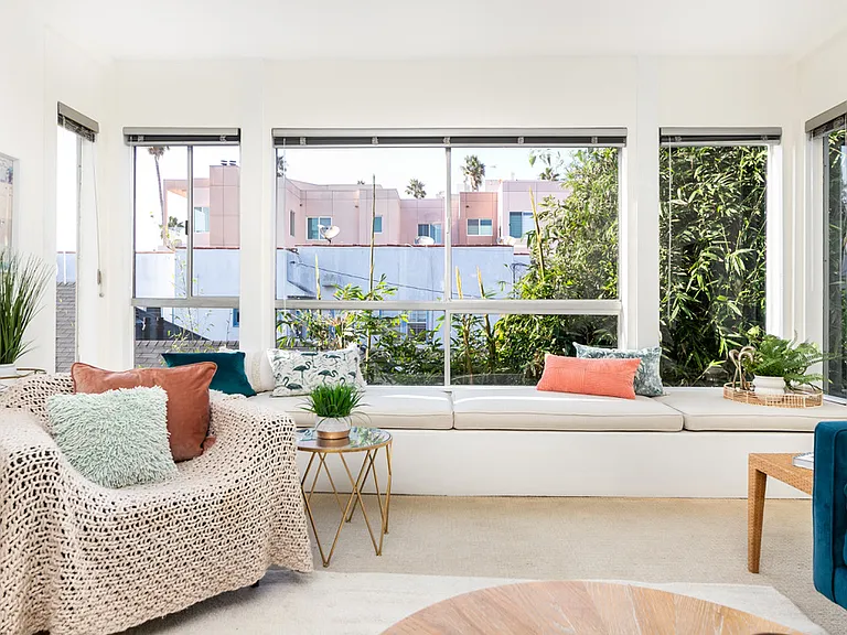 Custom 15' window seat with ocean-view nook for reading or sunset watching, and hidden storage.