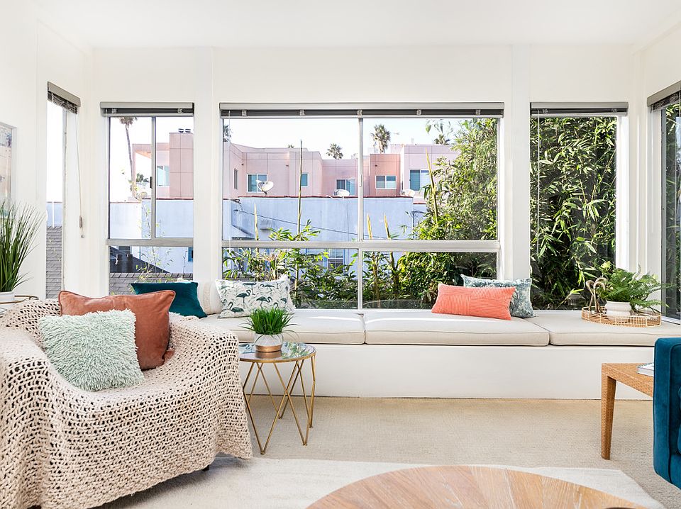 Custom 15' window seat with ocean-view nook for reading or sunset watching, and hidden storage.