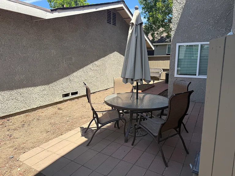 Private, gated patio area. Perfect for outdoor dining, lounging, and gardening.