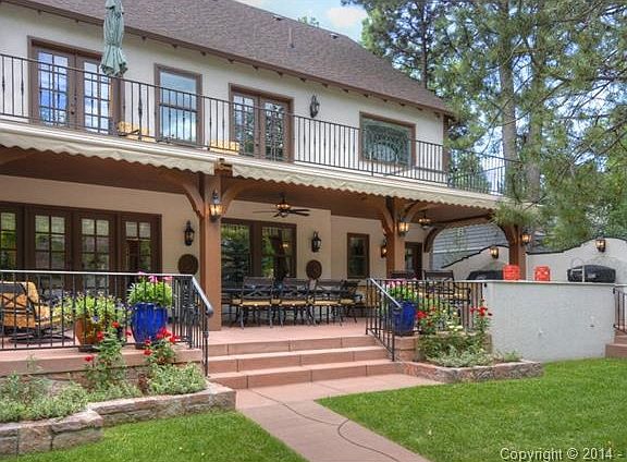 Close up of back patio and upper level deck that is off the mast