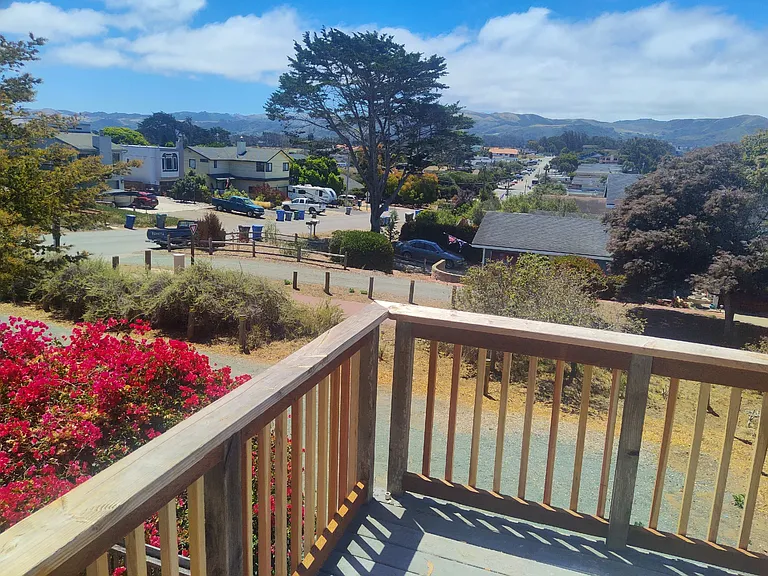 View of bike trail from living room/kitchen balcony