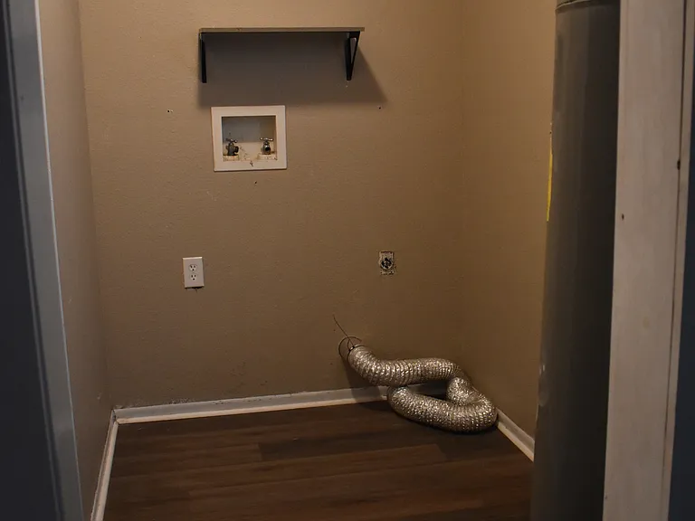 Dedicated laundry space with washer/dryer connections.