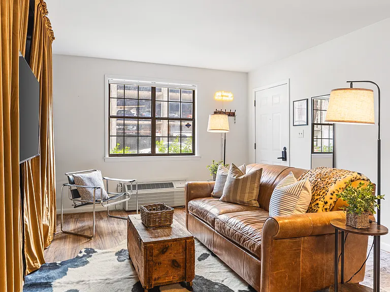 Cozy living room with a smart TV and a sleeper sofa. No stairs in this condo and located on the ground level, for easy access.