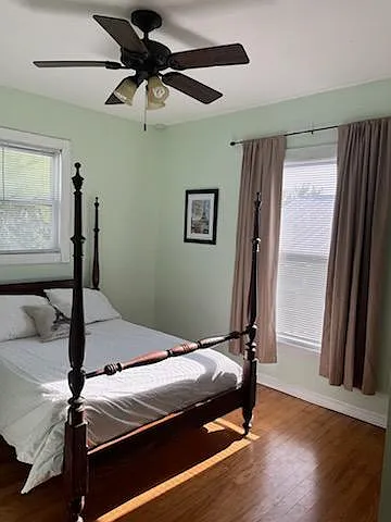 This is the second bedroom. It has a full-size poster bed, dresser and closet.