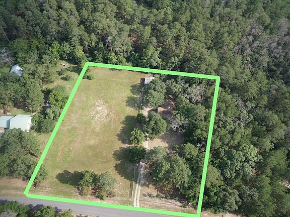 Aerial view of 2.5 acres, one lot cleared and fenced for horses.