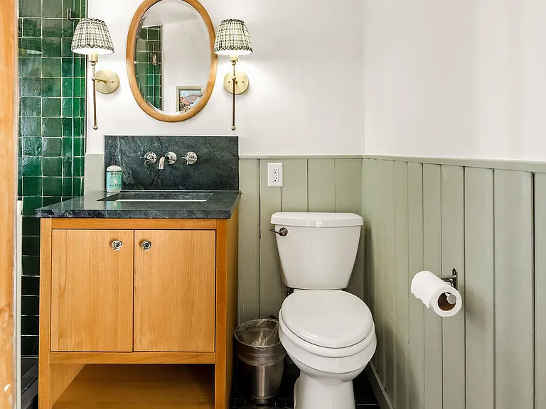 Full bathroom connected to TV room