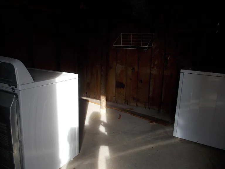 Private locked laundry room located in basement