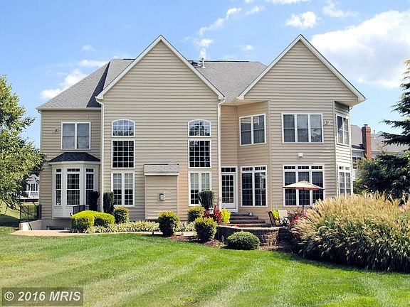 Lushly Landscaped .74 Acre with Entertaining Patio